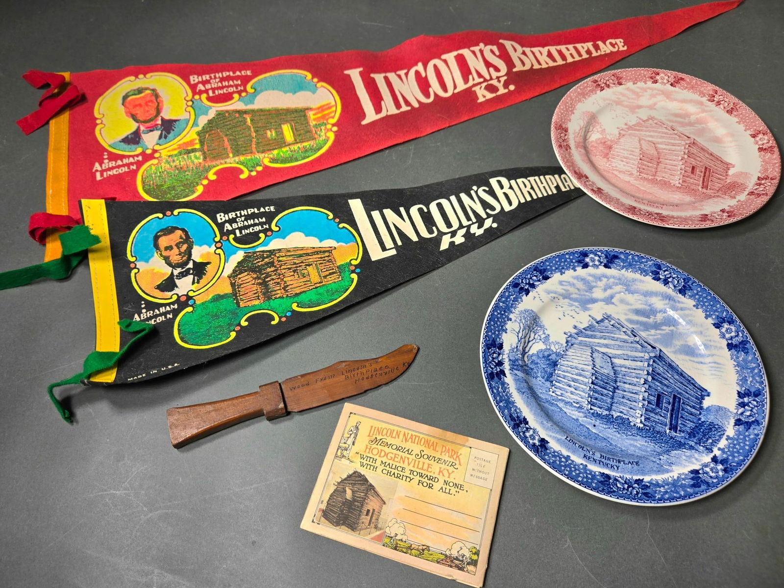 Group Lot of Abraham Lincoln Souvenir Pennants, Postcards, Wood Knife and Collector Plates: In-house shipping available. Pickup is Thursday, May 29 from from 1 pm to 7 pm at our gallery in Lancaster, OH 43130 or we will provide in-house shipping for this item. We charge a $5/lot fee if you p