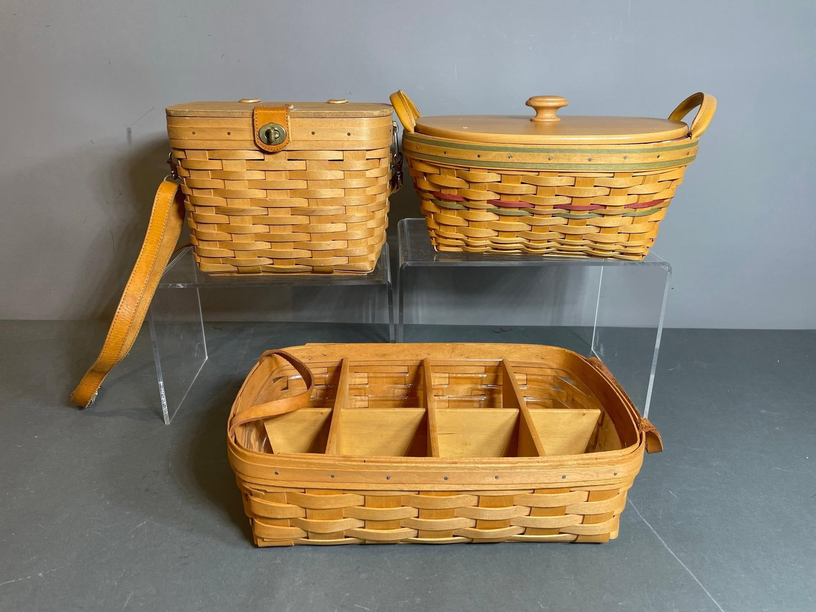 Group of Three Vintage Longaberger Baskets: In-house shipping available. Pickup is Thursday, May 29 from from 1 pm to 7 pm at our gallery in Lancaster, OH 43130 or we will provide in-house shipping for this item. We charge a $5/lot fee if you p