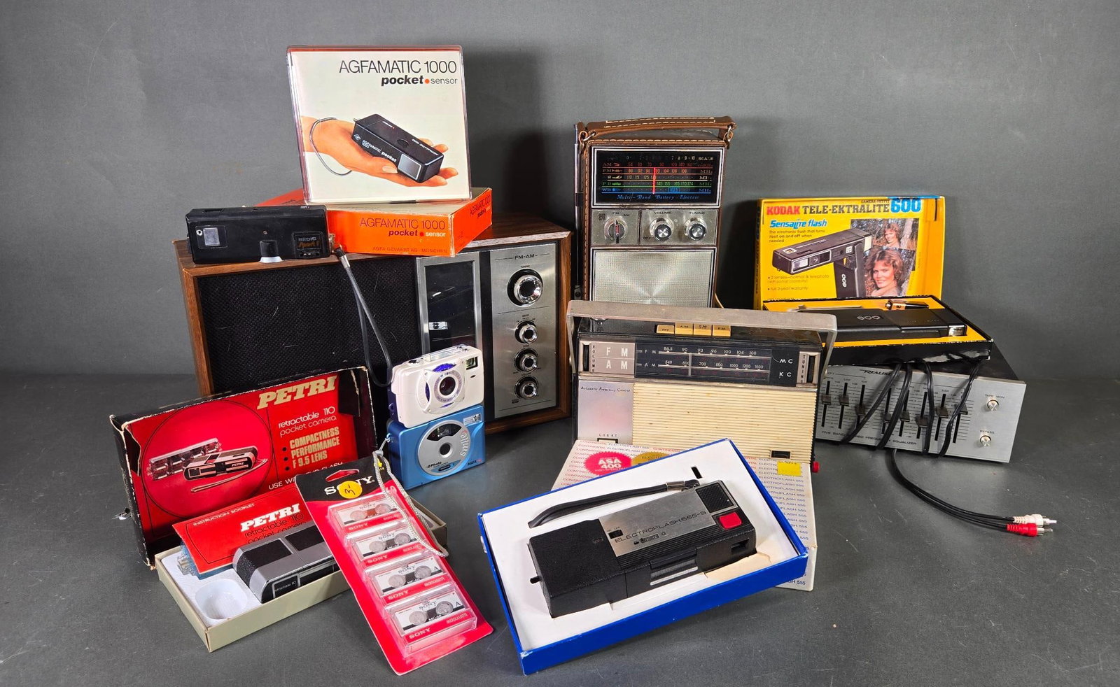 Vintage Group of Radios, Cameras, Mini Cassette Tapes, and Realistic Equalizer: In-house shipping available. Pickup is Thursday, May 29 from from 1 pm to 7 pm at our gallery in Lancaster, OH 43130 or we will provide in-house shipping for this item. We charge a $5/lot fee if you p