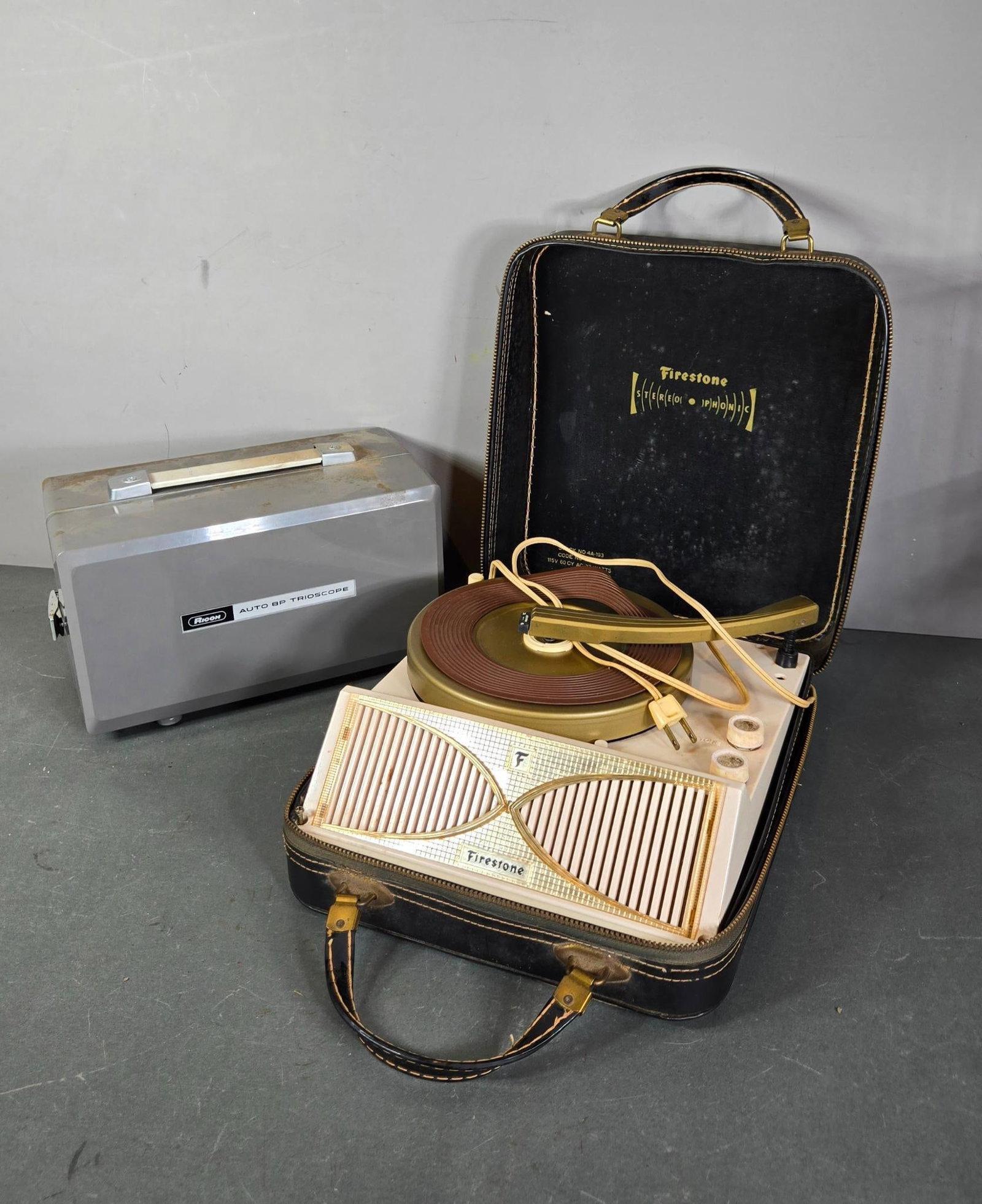 Vintage Ricoh Auto BP Trioscope and Vintage Firestone Portable Record Player: In-house shipping available. Pickup is Thursday, May 29 from from 1 pm to 7 pm at our gallery in Lancaster, OH 43130 or we will provide in-house shipping for this item. We charge a $5/lot fee if you p