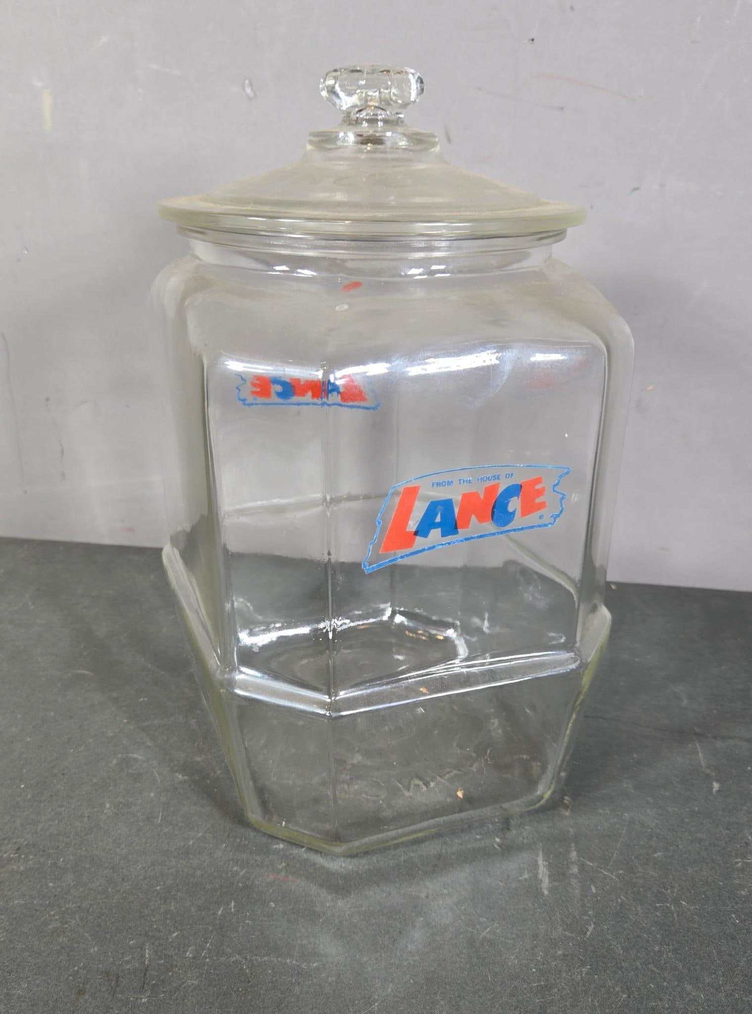 Vintage Glass Lance Candy Counter Display Jar with Lid: In-house shipping available. Pickup is Thursday, May 29 from from 1 pm to 7 pm at our gallery in Lancaster, OH 43130 or we will provide in-house shipping for this item. We charge a $5/lot fee if you p