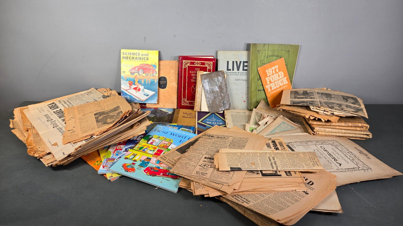 Group Lot of Vintage Newspapers, Books, and Other Ephemera: In-house shipping available. Pickup is Thursday, May 29 from from 1 pm to 7 pm at our gallery in Lancaster, OH 43130 or we will provide in-house shipping for this item. We charge a $5/lot fee if you p