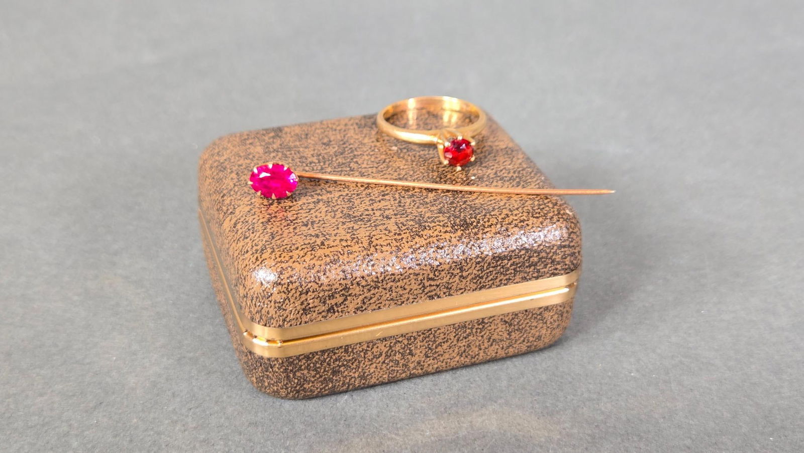Antique 10K Gold Ring and Gold Stick Pin, both with Red Stones: 3.29 grams of 10K gold. In-house shipping available. Pickup is Thursday, May 29 from from 1 pm to 7 pm at our gallery in Lancaster, OH 43130 or we will provide in-house shipping for this item. We char