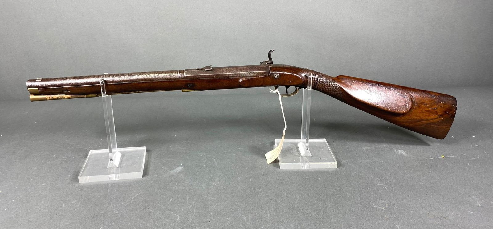 German 60 Cal 19th c. Percussion Coach Rifle Break Down Stock: MFG/IMPORTER: German - not marked with a maker. MODEL: Coach gun. SERIAL: NSN. CALIBER/GAUGE: 60 cal. CONDITION: Bore is good. Action locks back inconsistently. SIZE: 15.75" bbl length. NOTES: Rare st