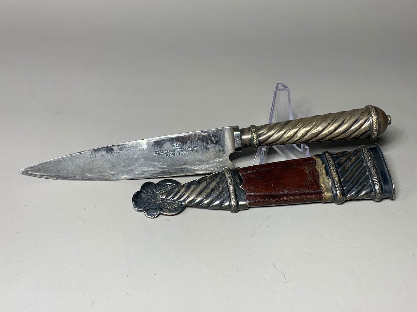Early H. Boker & Co. Arbolito Knife in Scabbard Gaucho Dagger: In-house shipping available. Pickup is Thursday, May 29 from from 1 pm to 7 pm at our gallery in Lancaster, OH 43130 or we will provide in-house shipping for this item. We charge a $5/lot fee if you p