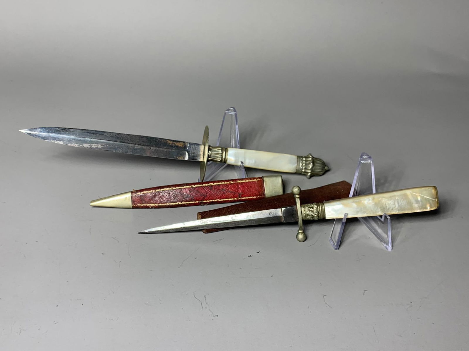 Two 19th Century Sheffield England Daggers Knives with Scabbards: In-house shipping available. Pickup is Thursday, May 29 from from 1 pm to 7 pm at our gallery in Lancaster, OH 43130 or we will provide in-house shipping for this item. We charge a $5/lot fee if you p