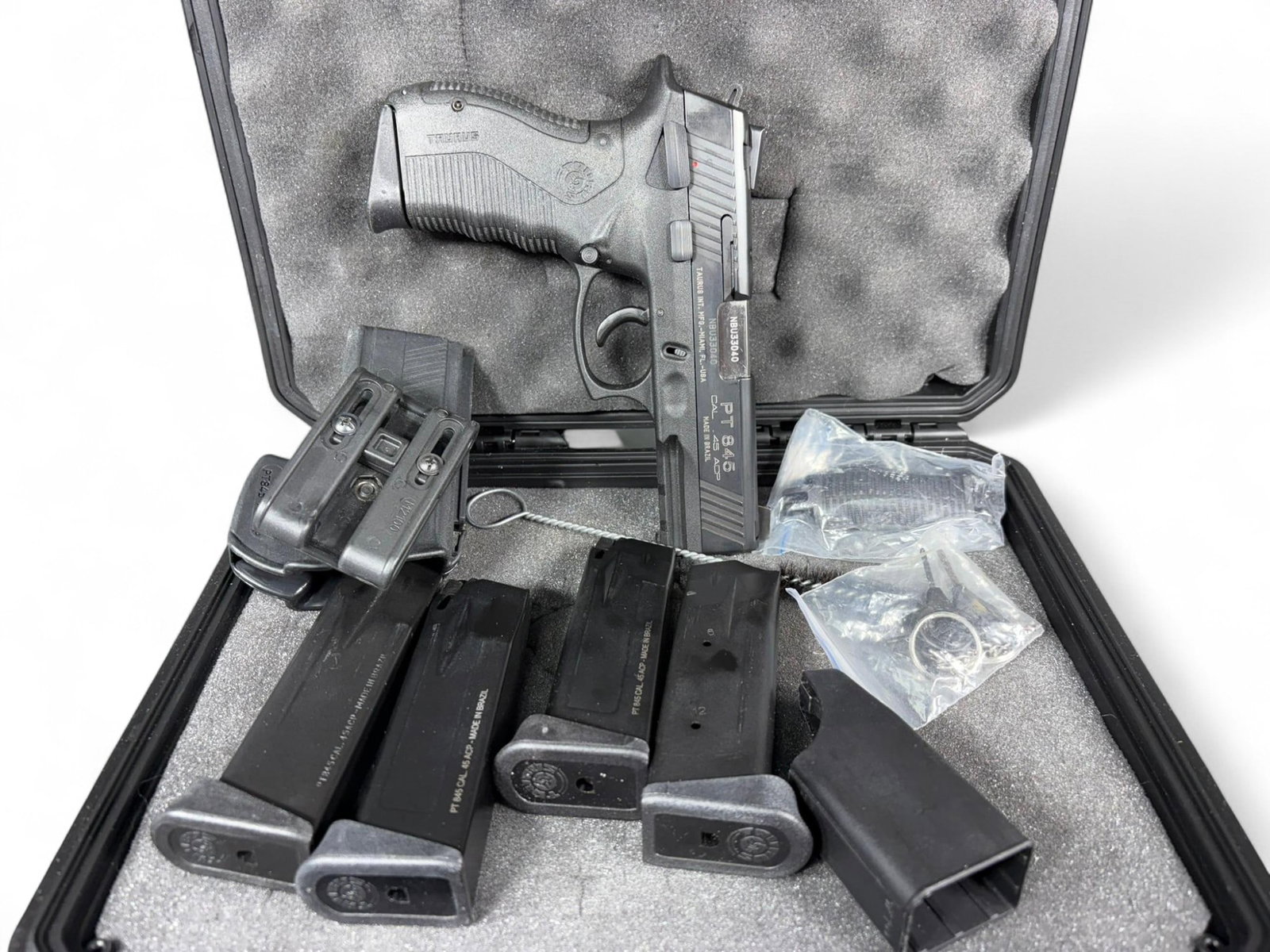 * Taurus PT845 Pistol 45 ACP w/6 mags, Hard Case: MFG/IMPORTER: Taurus MODEL: PT845 SERIAL: NBU33040 CALIBER/GAUGE: 45 ACP CONDITION: Action good, bore good. SIZE: 4" bbl. NOTES: 6 mags, hard case. In house shipping available. Unless you have an FFL,