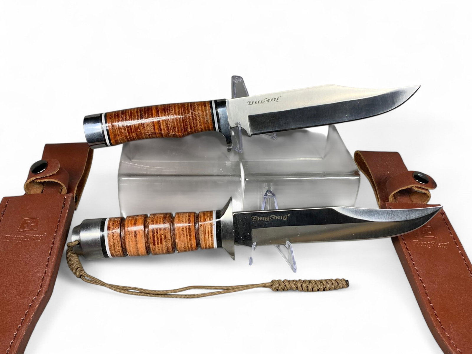 Two Vintage Military Style Sheath Knives ZhengSheng: Burns in-house shipping is available. pick up is Tuesday, July 28, from Noon to 7 pm at our gallery in Lancaster, Ohio 43130 or we will provide in-house shipping for this item. We will charge a $5 fee