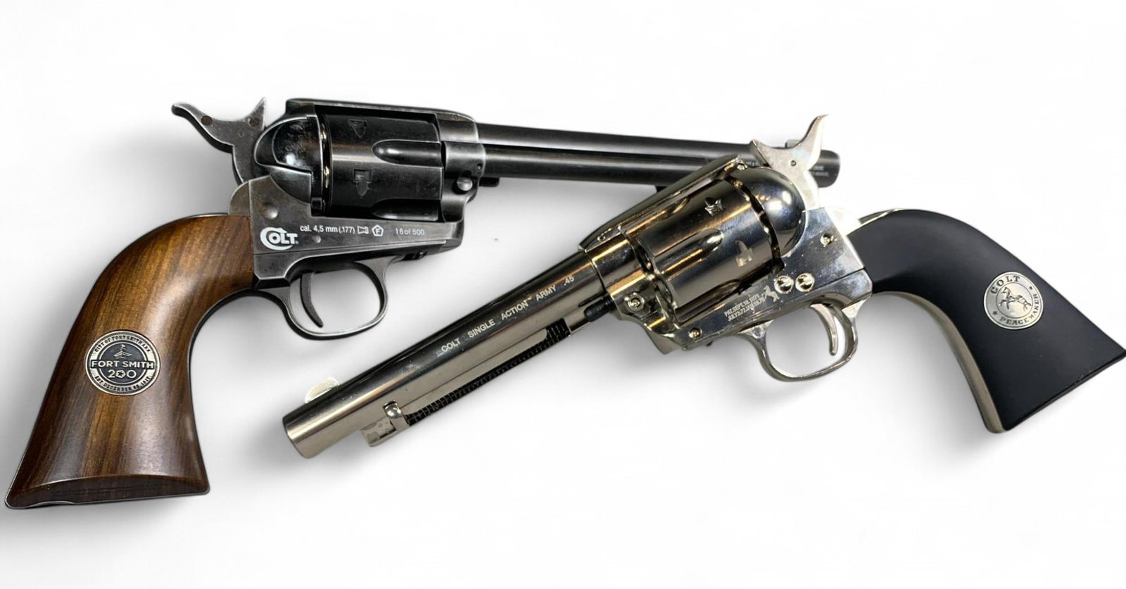 Two Colt Single Action Army Air Guns Pistols: Burns in-house shipping is available. pick up is Tuesday, July 28, from Noon to 7 pm at our gallery in Lancaster, Ohio 43130 or we will provide in-house shipping for this item. We will charge a $5 fee