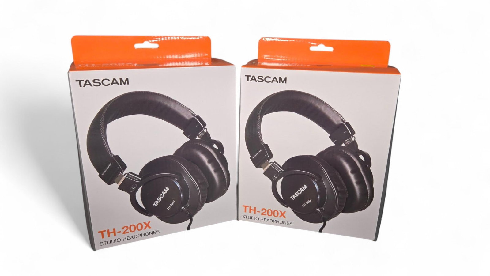 Two Pairs of Tascam Studio Headphones In Original Boxes: Burns in-house shipping is available. pick up is Tuesday, July 28, from Noon to 7 pm at our gallery in Lancaster, Ohio 43130 or we will provide in-house shipping for this item. We will charge a $5 fee