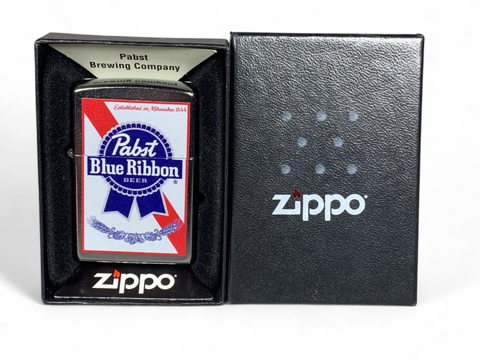 Pabst Blue Ribbon Zippo Lighter in Box: Burns in-house shipping is available. pick up is Tuesday, July 28, from Noon to 7 pm at our gallery in Lancaster, Ohio 43130 or we will provide in-house shipping for this item. We will charge a $5 fee