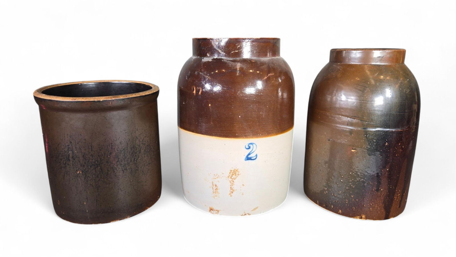 Three Antique Stoneware Jars: Burns in-house shipping is available. pick up is Tuesday, July 28, from Noon to 7 pm at our gallery in Lancaster, Ohio 43130 or we will provide in-house shipping for this item. We will charge a $5 fee