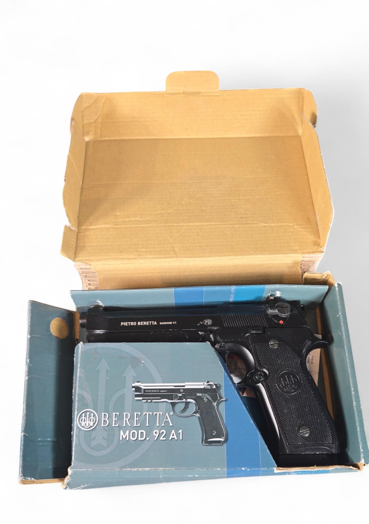 Beretta Model 92A1 Style Air Pistol in Box: Burns in-house shipping is available. pick up is Tuesday, July 28, from Noon to 7 pm at our gallery in Lancaster, Ohio 43130 or we will provide in-house shipping for this item. We will charge a $5 fee