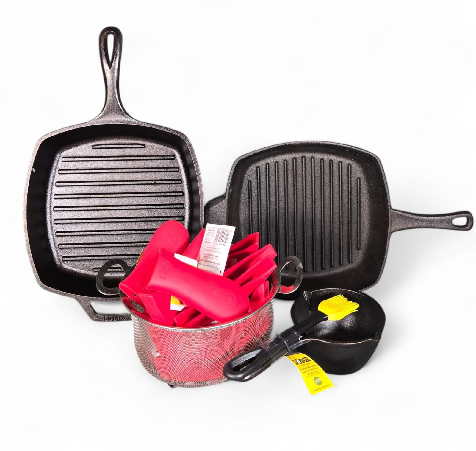 New Lodge Cast Iron Grooved Skillets, Pot, Silicone Handle Assists and Strainer: Burns in-house shipping is available. pick up is Tuesday, July 28, from Noon to 7 pm at our gallery in Lancaster, Ohio 43130 or we will provide in-house shipping for this item. We will charge a $5 fee