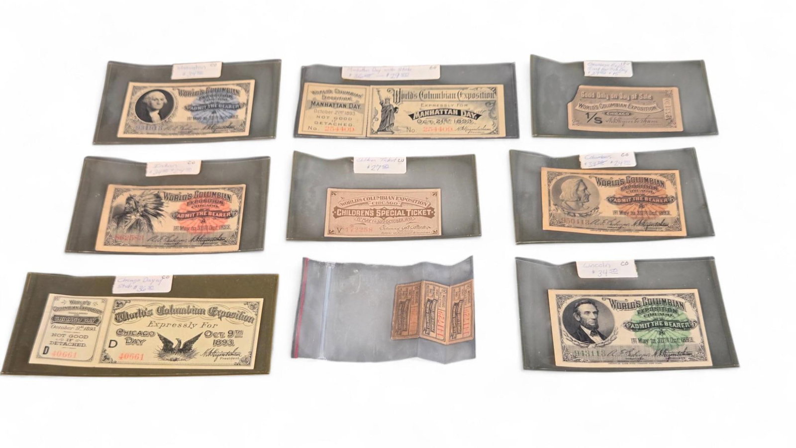 Collectible Lot - Vintage Historical Paper Money & Ephemera - World's Columbian Exposition, Fract...: This lot comprises a varied collection of historical paper items. Among them are a World's Columbian Exposition Chicago 'Admit the Bearer' ticket from 1893, featuring a portrait of Abraham Lincoln. Ot