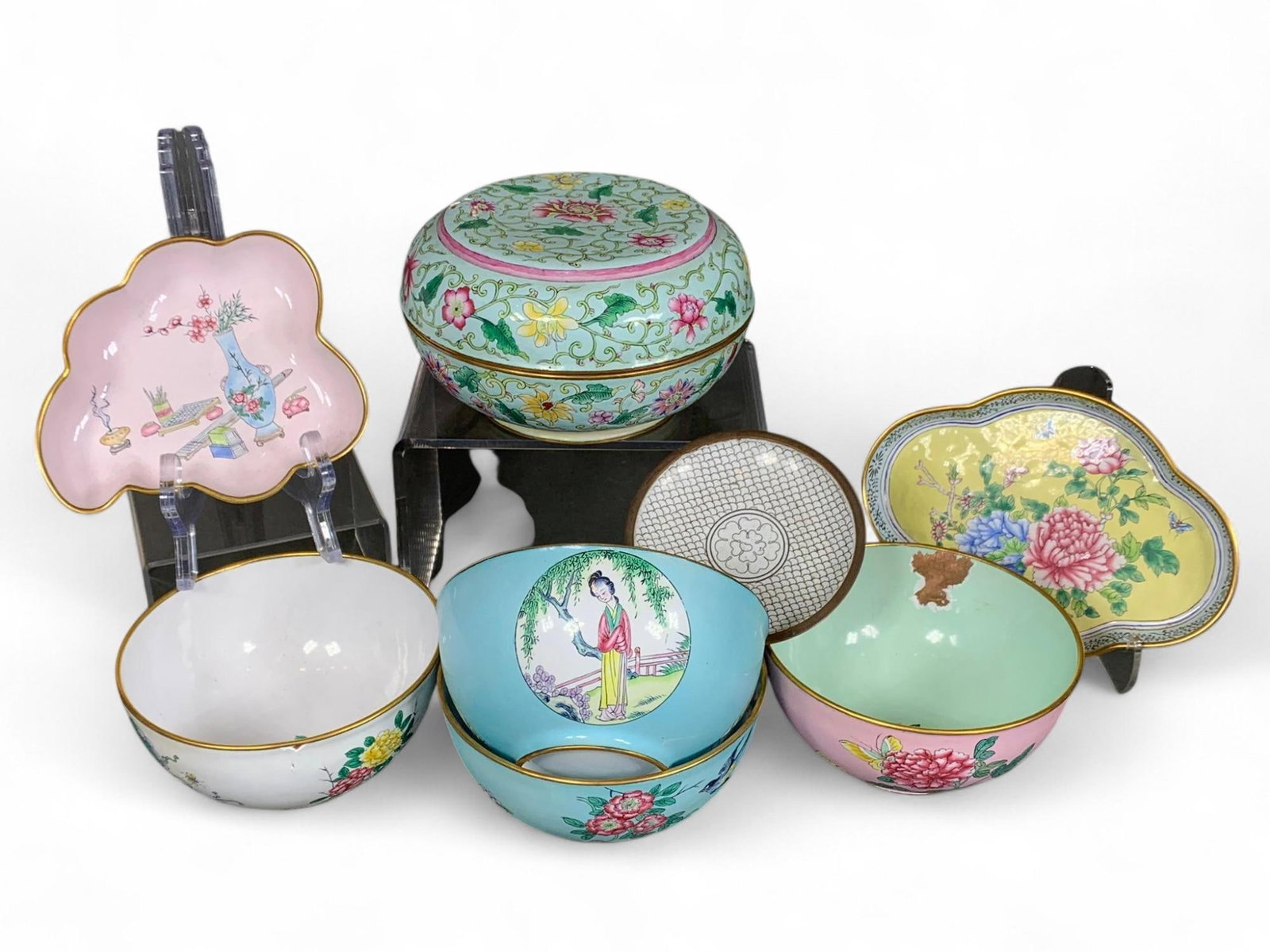 Chinese Enamel Porcelain Collection Floral Figural Home Decor: This collection comprises Chinese enamel porcelain pieces, each showcasing detailed craftsmanship. It includes a lidded box adorned with continuous floral patterns in soft pastel tones. Also featured
