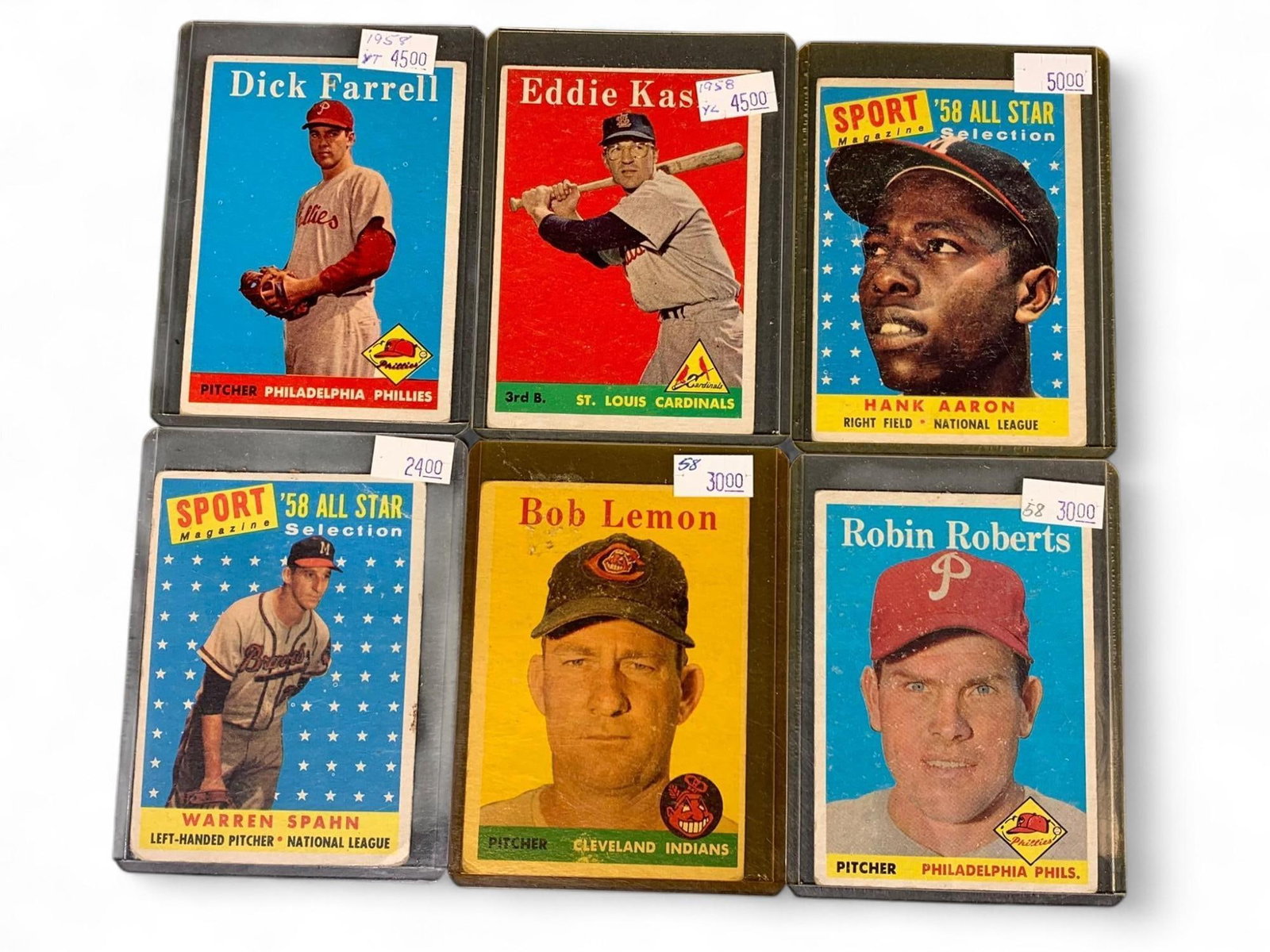 Vintage Baseball Cards Topps 1958-59 Series: This lot presents a collection of vintage Topps baseball cards, primarily from the 1958 and 1959 series. The cards feature prominent players such as Hank Aaron (1958 All-Star), Robin Roberts, Warren S