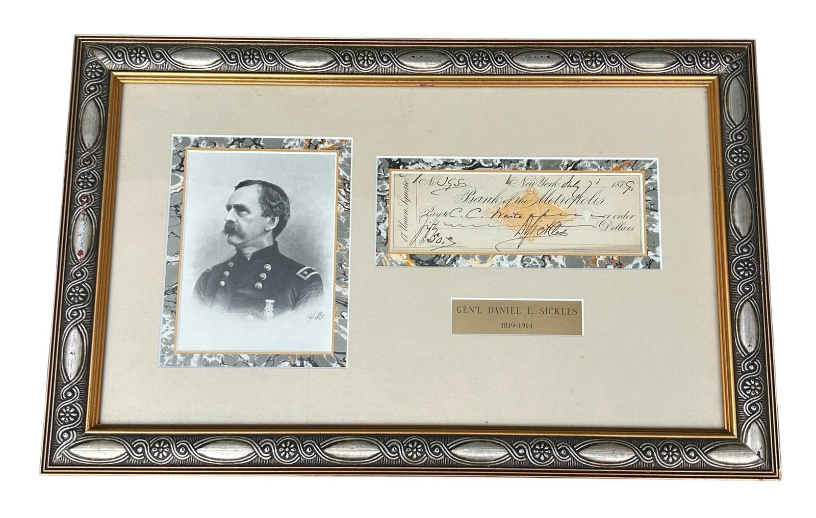 Civil War General Dan Sickles Framed Autograph: 1879 bank check signed by Civil War General Daniel Sickles. The check is professionally framed along with an engraving of Sickles and a small plaque that lists his year of birth and death. The frame m