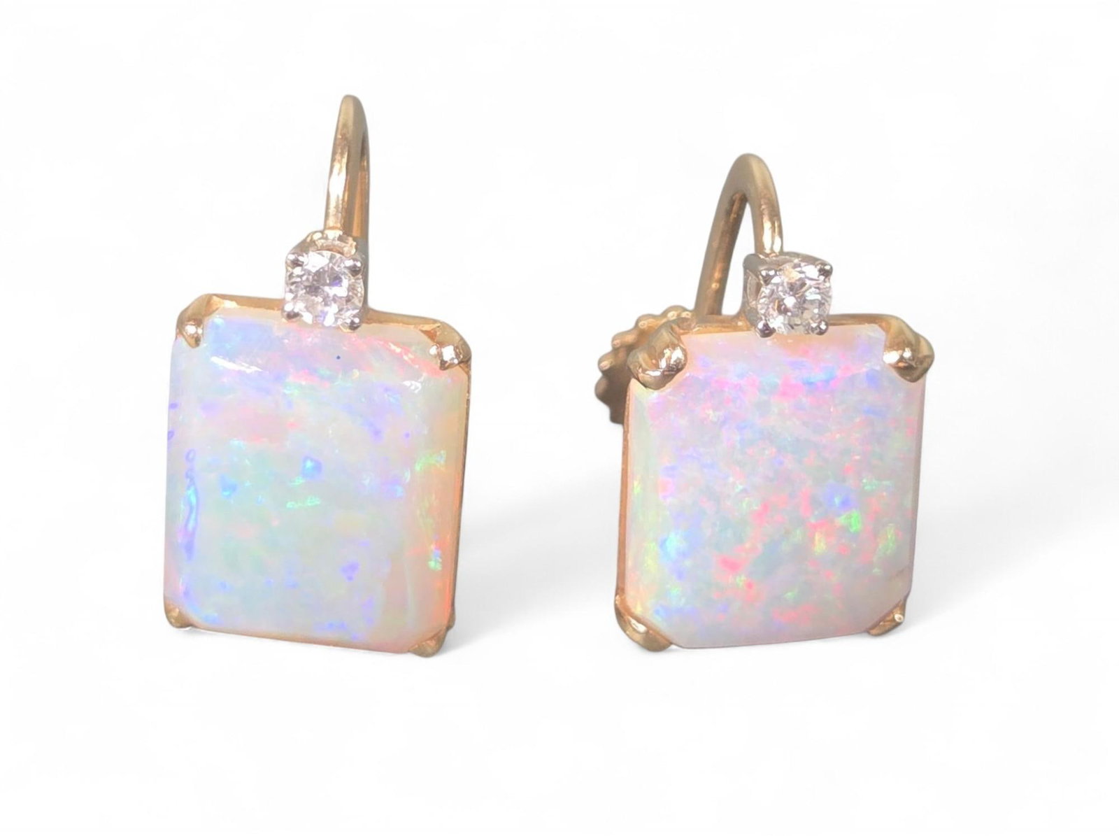 14K Gold Opal & Diamond Lever Back Earrings: These exquisite earrings feature beautiful rectangular opals, known for their iridescent play-of-color. Each opal is securely set in 14K gold with a brilliant small diamond accent above it, adding a t