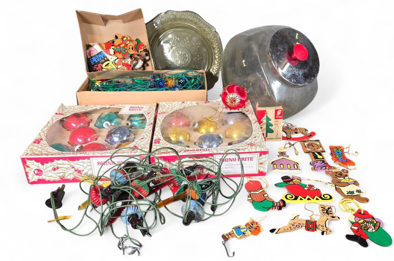 Vintage Christmas Decoration Lot More - Glass Ornaments, String Lights, Wooden Decor, Candy Ja: This lot offers a diverse collection of vintage Christmas decorations, showcasing a range of materials and festive designs. It includes multiple boxes of Mini Brite glass ornaments, presenting classic
