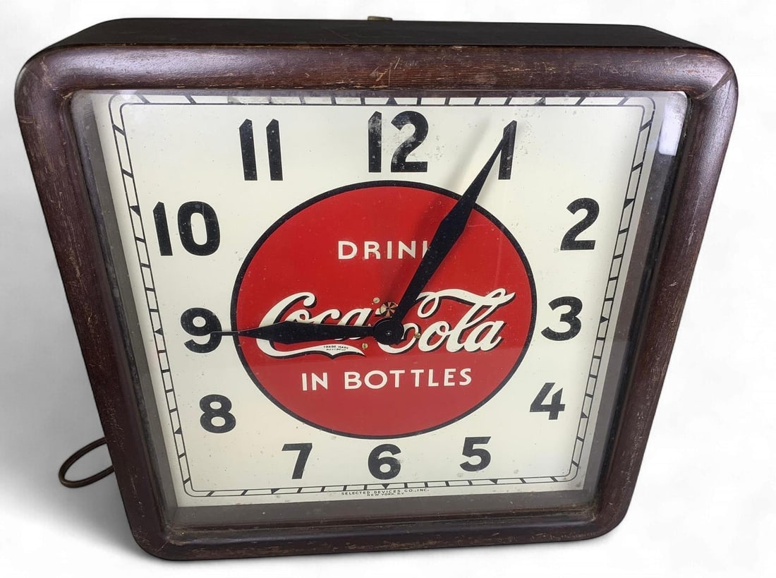 Vintage 1930s Selected Devices Co. Coca-Cola 'Select O'clock' Advertising Wall Clock: A vintage electric advertising wall clock, identified as a 'Selector Clock' by Selected Devices Co., Inc., dating to the 1930s. The clock features a square-shaped dark stained wooden case with rounded