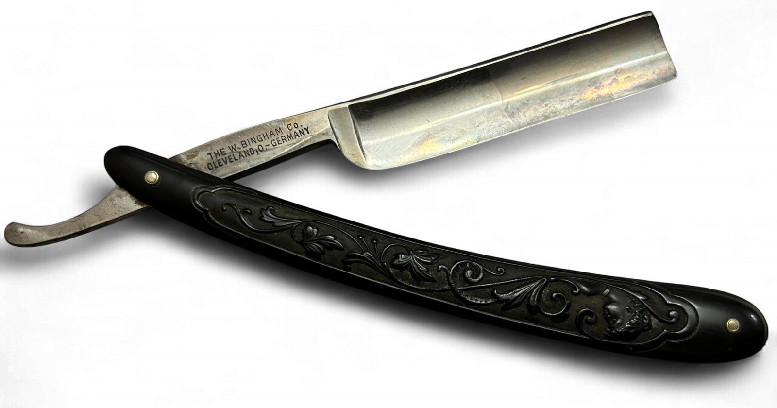 Centurion Straight Razor W. Bingham Co. Cleveland Ohio Made in Germany: Vintage Centurion straight razor. The scales feature floral motif and Roman busts. The tang is stamped "W. Bingham Co. Cleveland, Ohio - Germany" on one side and "CENTURION" on the other. Blade width 