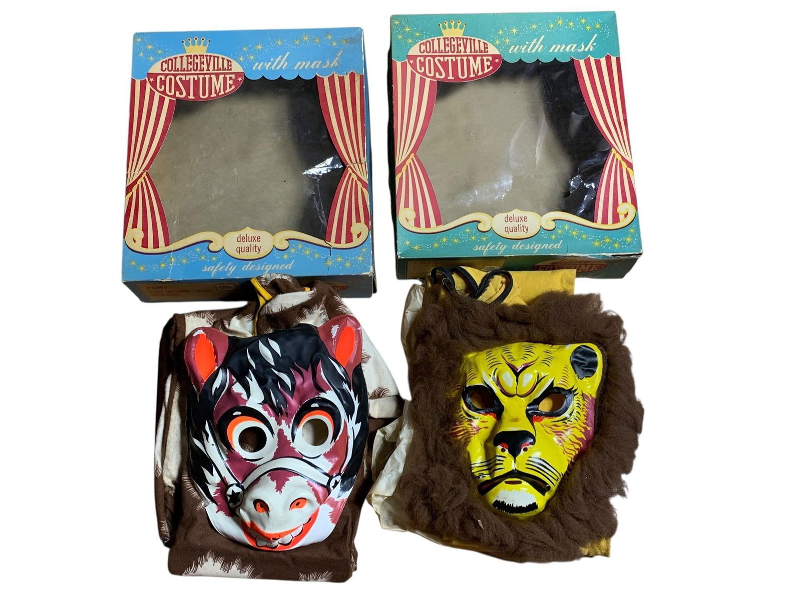 A Pair of Vintage Collegeville Children's Halloween Costumes: Lion and Pony: A Pair of vintage Collegeville children's Halloween costumes, comprising a Lion and a Pony. Each costume features a full-body jumpsuit and a corresponding molded plastic mask, accompanied by their ori