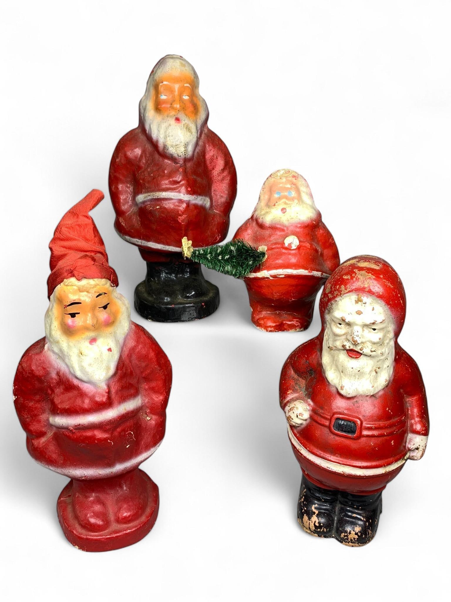 A Group of Mid-20th Century Composition Santa Claus Figures (1 of 14)