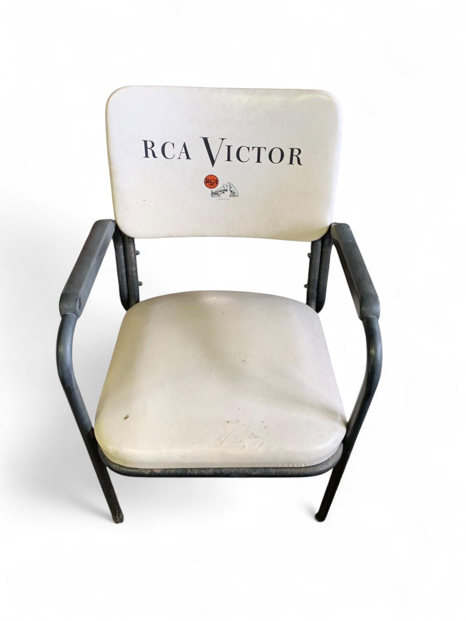 RCA Victor Advertising Armchair by Chromcraft, Mid-20th Century: A Mid-20th Century RCA Victor advertising armchair, manufactured by Chromcraft Corporation of St. Louis, MO. The chair features a dark-painted tubular metal frame with integrated armrests and cream/of