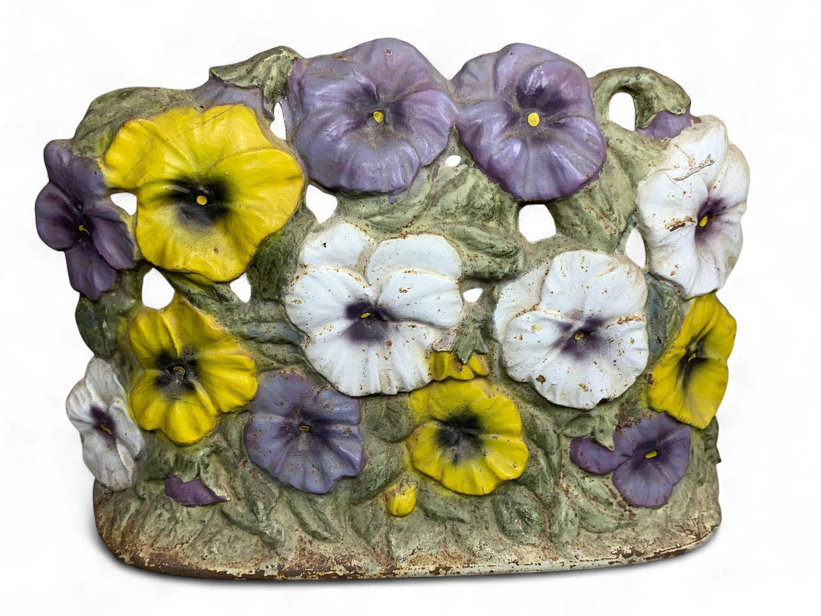 A Vintage Cast Iron Pansy Doorstop, Signed J.R. Palmer: A vintage cast iron doorstop, cast in a naturalistic style depicting a dense cluster of pansy flowers and foliage. The front is painted in multiple colors, featuring yellow, purple, and white pansies 
