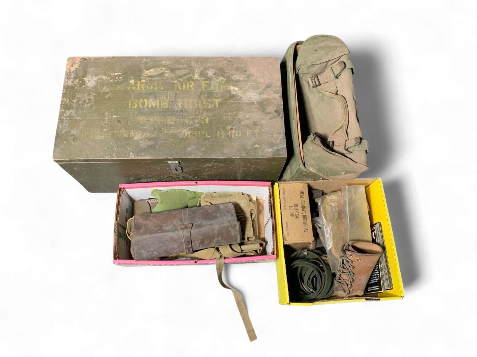 A Collection of World War II Era U.S. Army Air Forces Military Surplus: This lot comprises a collection of World War II era U.S. Army Air Forces military surplus items. The centerpiece is a large olive green wooden transport crate, stenciled with "ARMY AIR FORCES BOMB HOI