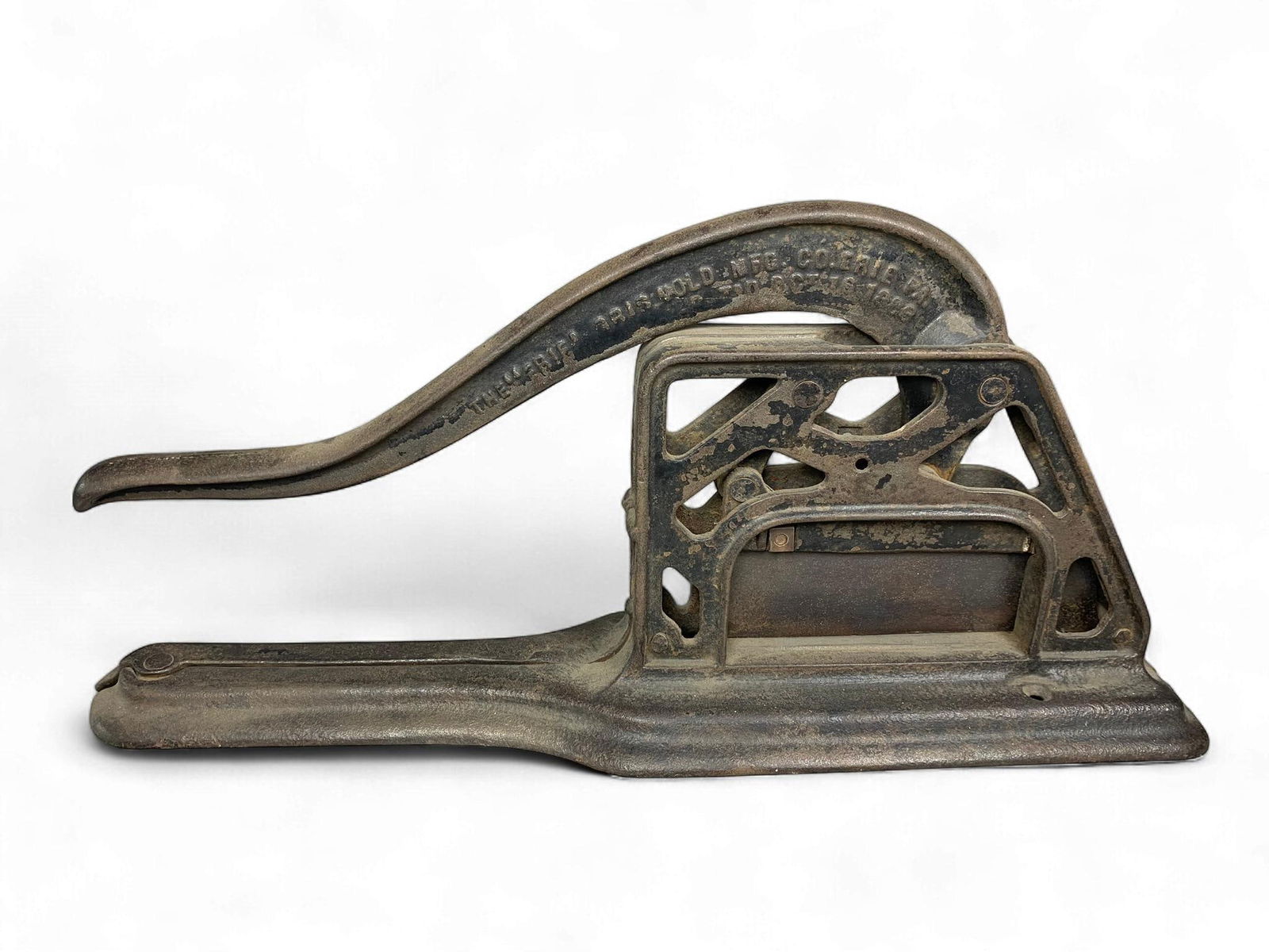 Griswold Cast Iron Tobacco Cutter, Patented 1894: A Griswold cast iron tobacco cutter, patented October 16, 1894. Constructed from heavily cast iron, the design is industrial, consistent with a late 19th to early 20th-century period. Visible markings