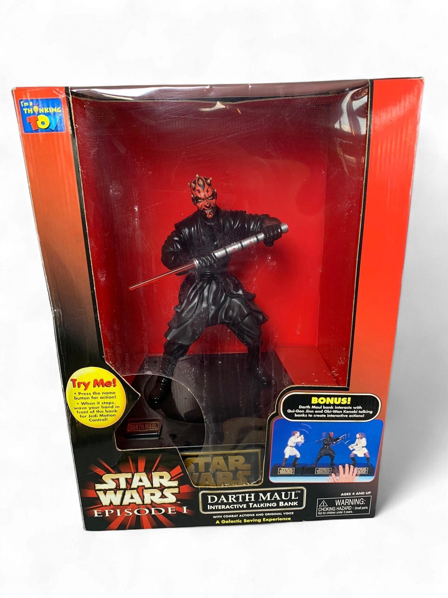 Star Wars Episode I Darth Maul Interactive Talking Bank by The Thinking Toy: A "Star Wars Episode I Darth Maul Interactive Talking Bank" by The Thinking Toy, product number NO. 13709. This collectible toy features a plastic figure of Darth Maul holding a red lightsaber, depict