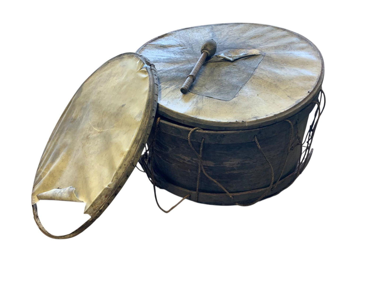 A Late 19th Century Inscribed Bass Drum with Beater, Newark, Ohio Opera House, 1884: An antique bass or marching drum, constructed with a wooden shell, animal hide drumheads, and metal rims secured by rivets, featuring a rope tensioning system. The top drumhead bears handwritten inscr