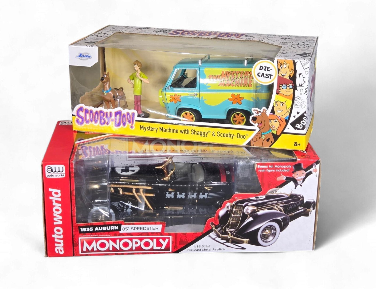 A Group of diecast Vehicle Models: Auto World Monopoly 1935 Auburn 851 Speedster and Jada 'Hollywood (1 of 7)