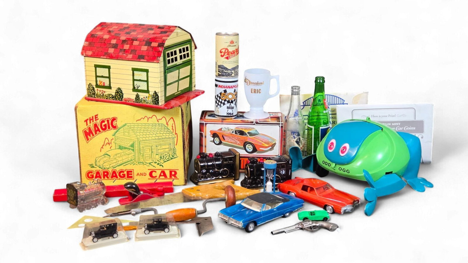 A 1968 Pontiac Bonneville Dealer Promo Model Car and a Collection of Vintage Toys and Collectibles: A diverse lot featuring a 1968 Pontiac Bonneville Dealer Promo Model Car, blue with a black roof, appearing complete. Also included is a red 1960s-1970s Cadillac Eldorado model car, appearing complete