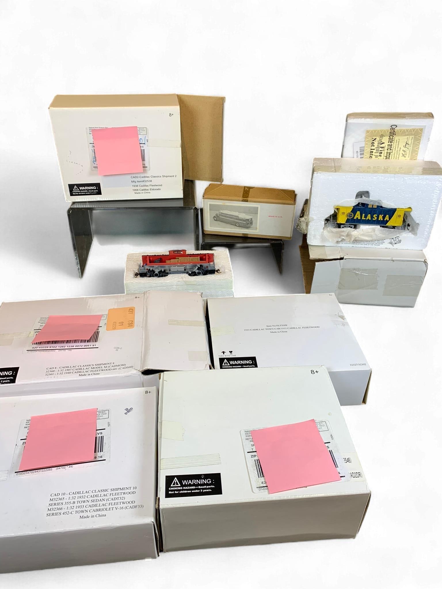 A Collection of Cadillac Classics diecast Model Cars, Model Railway Rolling Stock, and a Model Bus (1 of 12)