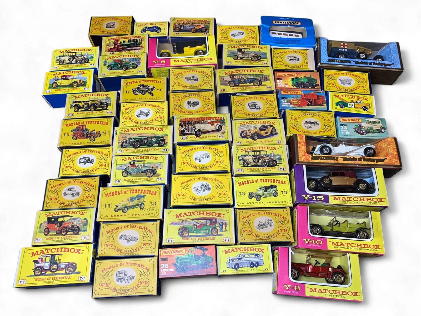 A Collection of Matchbox Lesney Models of Yesteryear and Matchbox Series diecast Vehicles, with Orig: An extensive collection of diecast model vehicles, primarily from the "Matchbox Models of Yesteryear" series, alongside various "Matchbox Series" models, each accompanied by its original cardboard or
