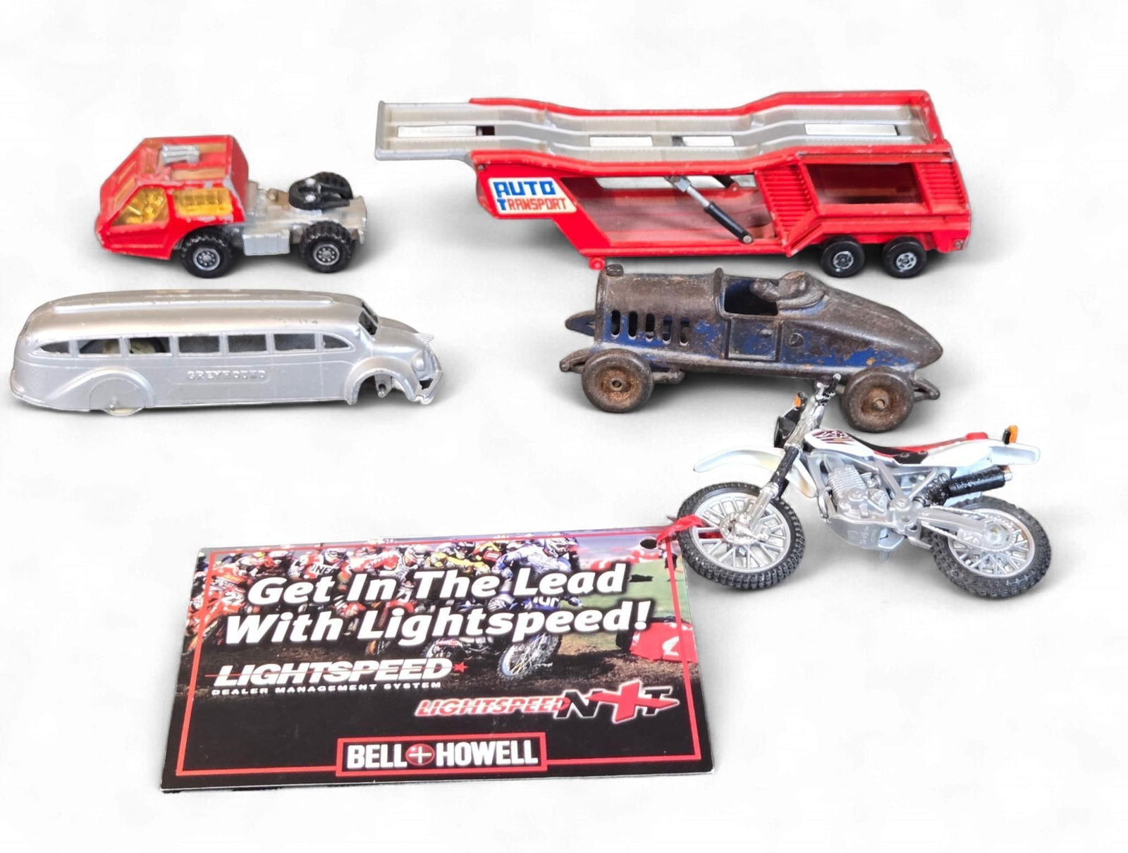 A Tootsietoy 1930s Greyhound Bus and a Collection of Toy Vehicles and a Promotional Card (1 of 15)