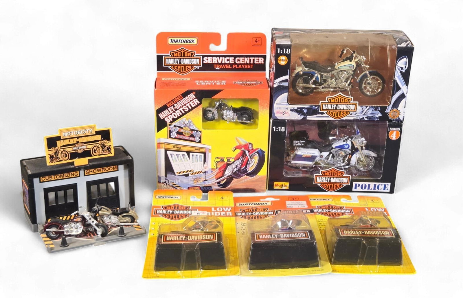A Collection of 1990s Harley-Davidson Matchbox and Maisto Toy Vehicles and Playsets: This lot comprises a collection of Harley-Davidson themed toy vehicles and playsets, primarily dating from the 1990s, as indicated by visible Matchbox Â©1993 and Maisto Â©1998 copyright dates. The