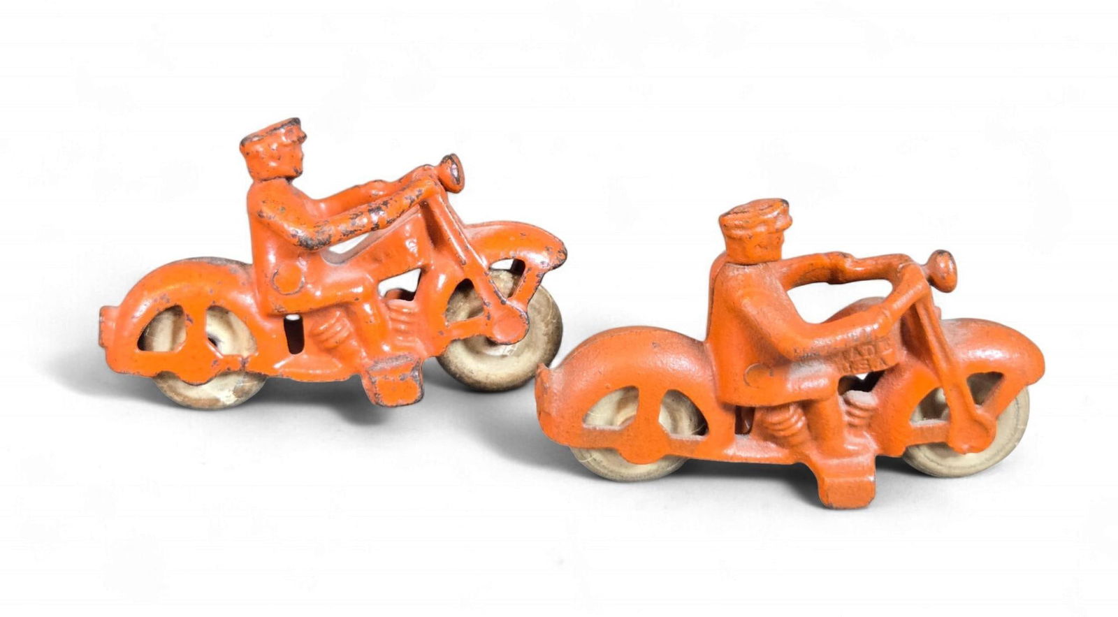 A Group of Hubley Cast Iron Motorcycle Cop Toys, circa 1930s (1 of 7)