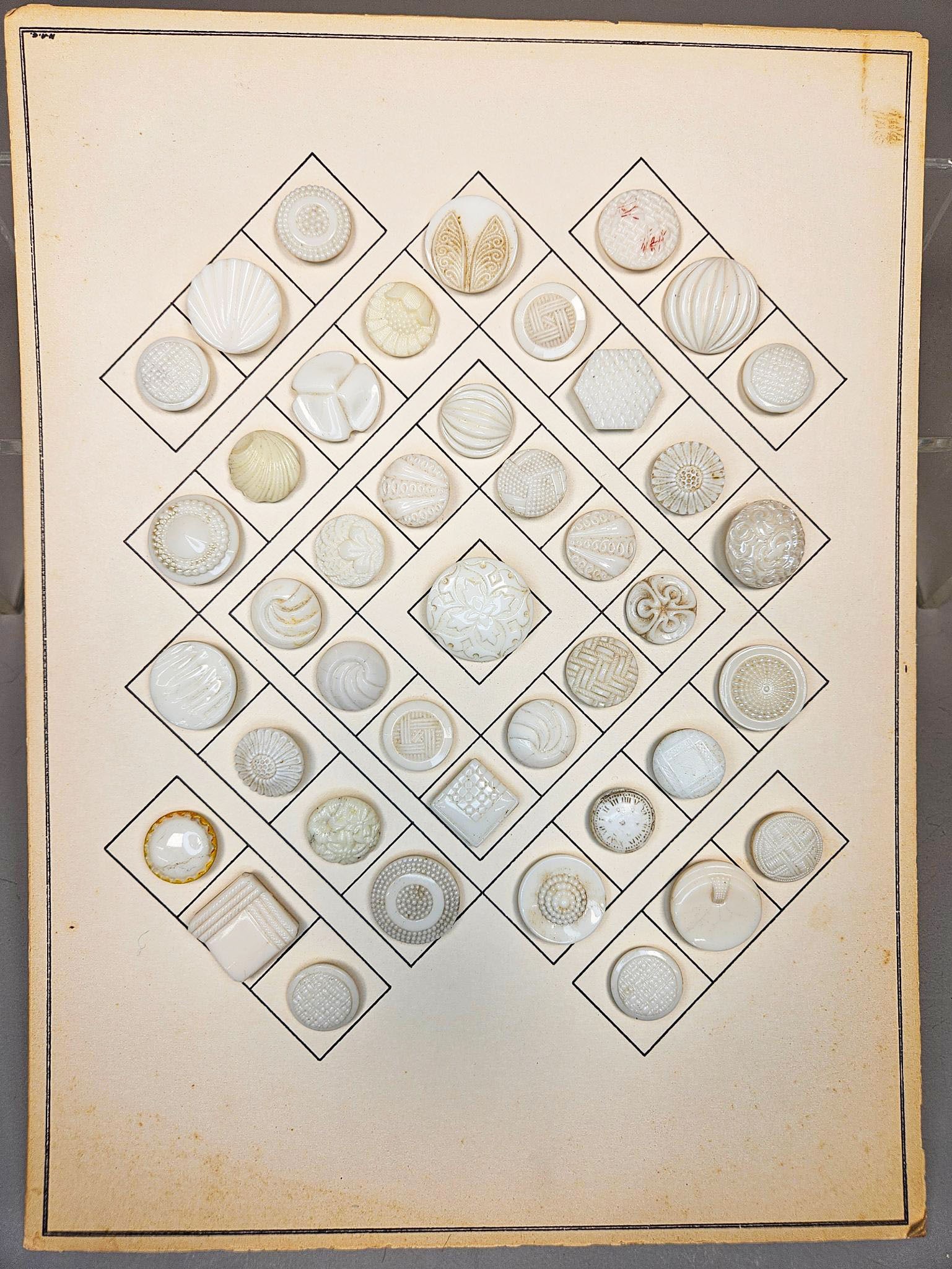 A Collection of Antique Milk Glass Buttons on Display Card (1 of 15)