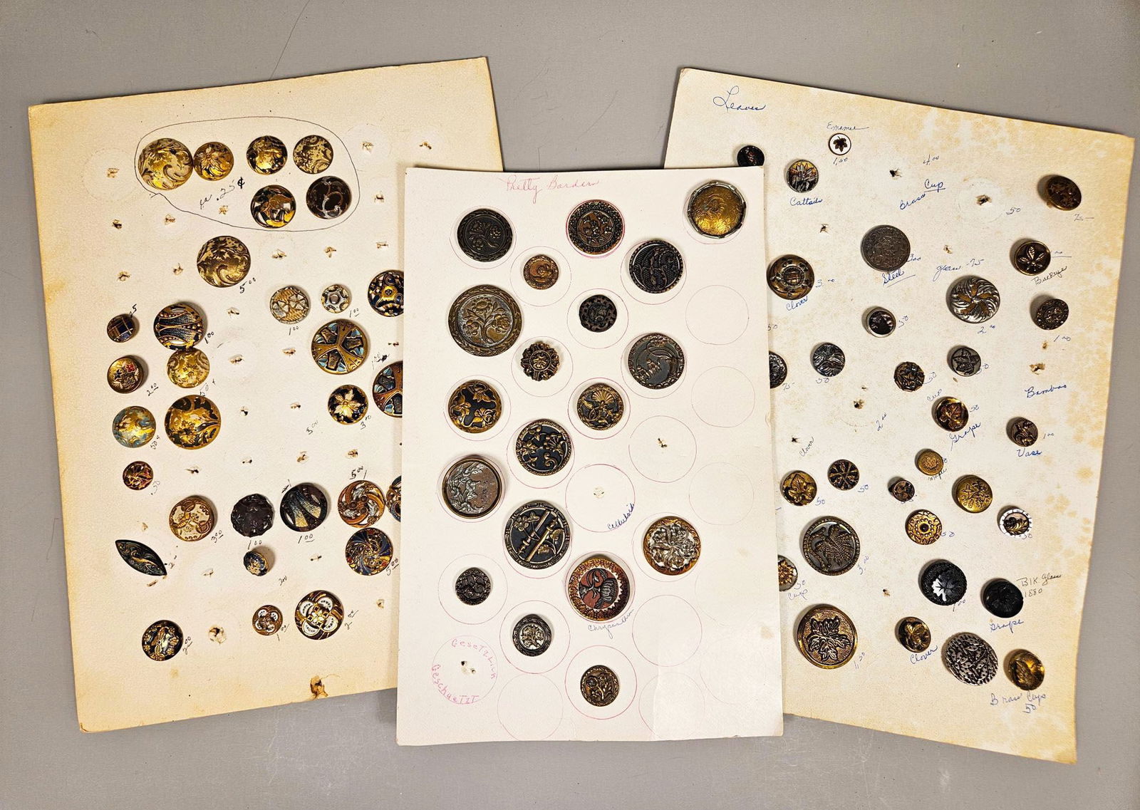 A Collection of Antique and Vintage Buttons, including Damascene-Style Examples, mounted on group of (1 of 19)