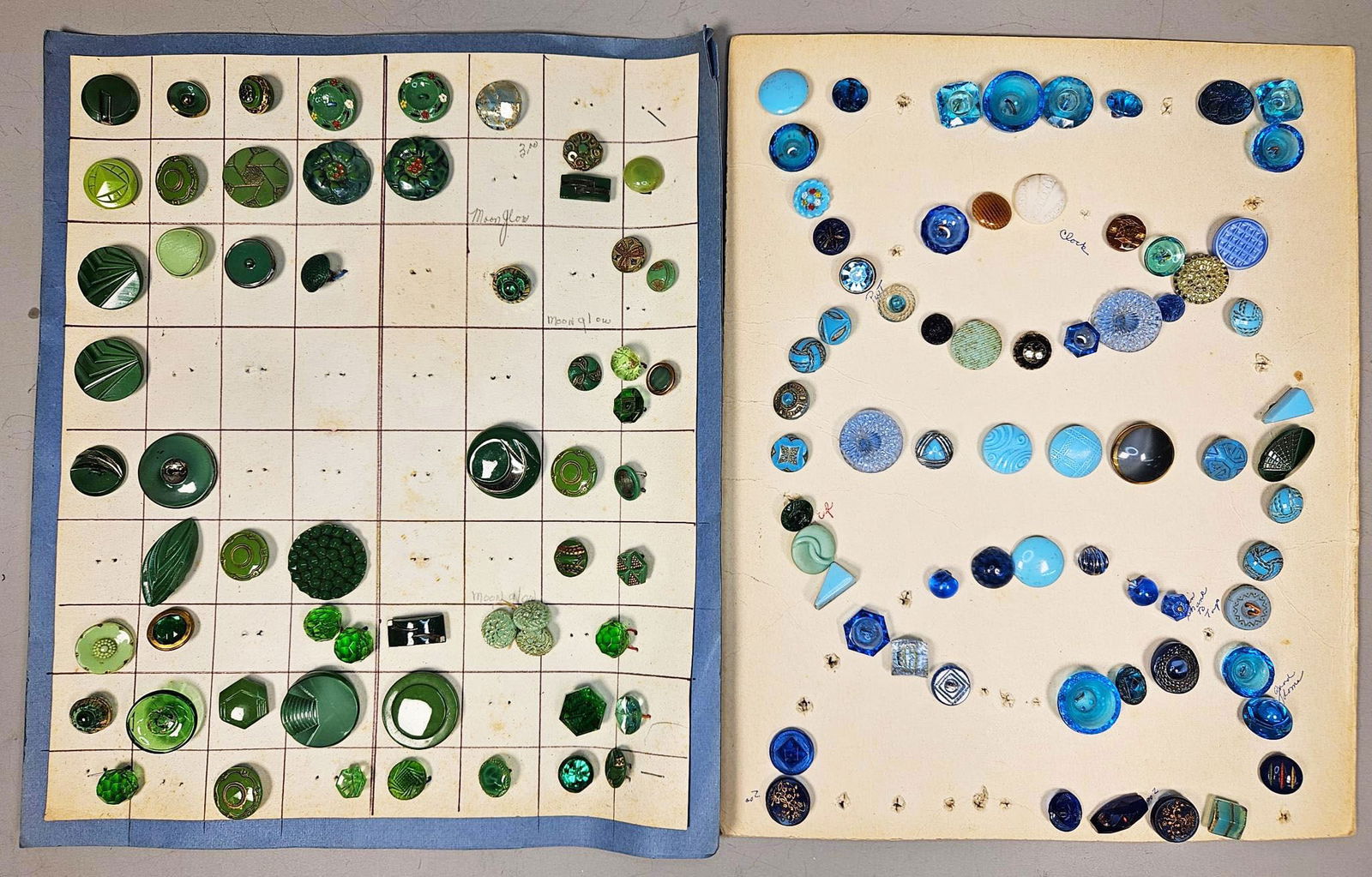 A Large Collection of Vintage Glass and Plastic Buttons, Predominantly Blue and Green, Including: This lot comprises a large collection of vintage buttons, primarily fashioned from various types of glass, including faceted, molded, and iridescent examples, alongside plastics such as Bakelite, cell