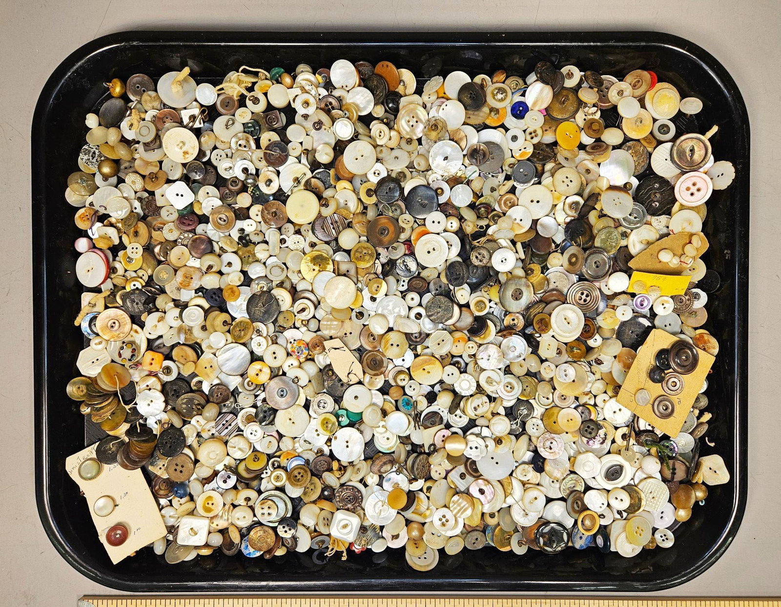 A Collection of 19th Century Mother of Pearl, Bone and Other Natural Materials Buttons: A substantial collection of buttons, identified through web intelligence and user-provided keywords as primarily 19th Century Mother of Pearl, Bone and Other Natural Materials. This assortment is dens