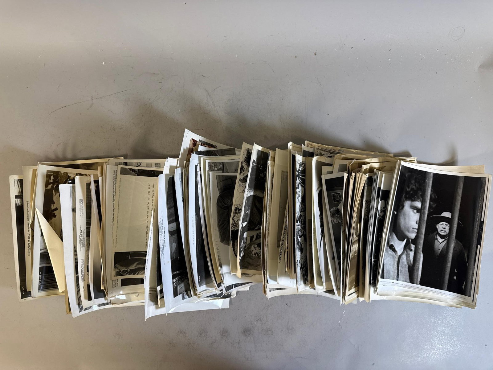 A Collection of Vintage Movie and Television Promotional Publicity Stills and Press Materials, circa: A collection of approximately 50-100 vintage black and white photographic prints, primarily glossy publicity stills, accompanied by associated press release documents. The photographs depict various s