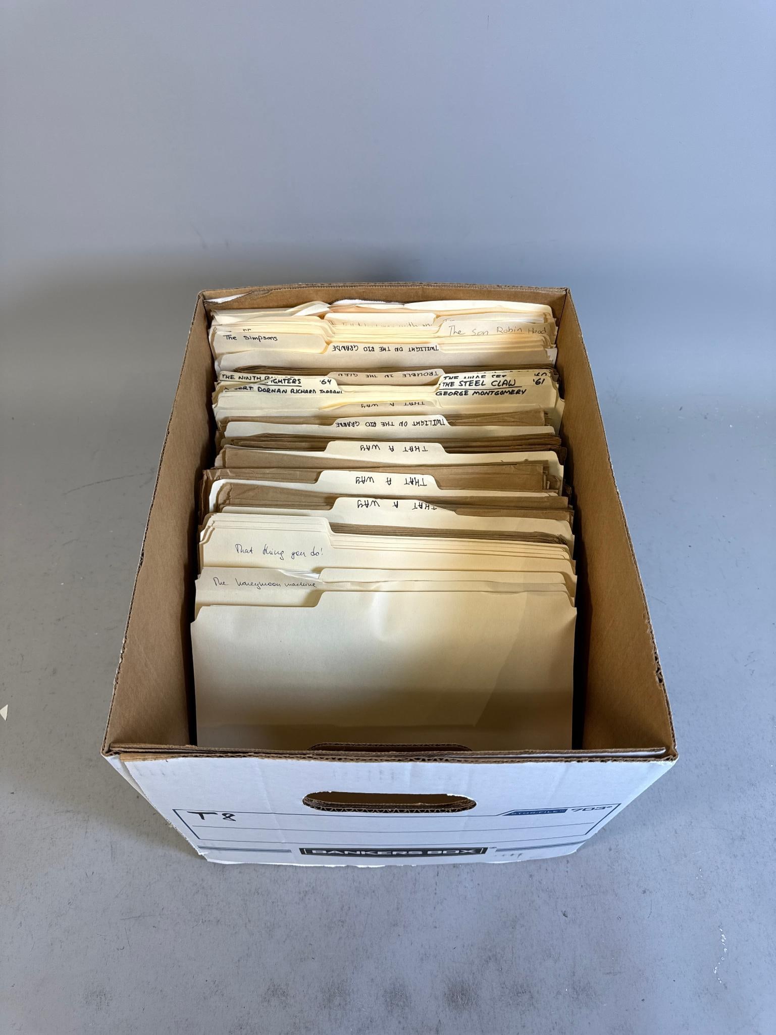 A Collection of Vintage Promotional Movie and Television Publicity Photos and Documents: A collection of vintage promotional movie and television publicity photos and documents, primarily spanning from the early 1960s to the late 1990s. Housed in a Bankers Box-brand cardboard storage box,