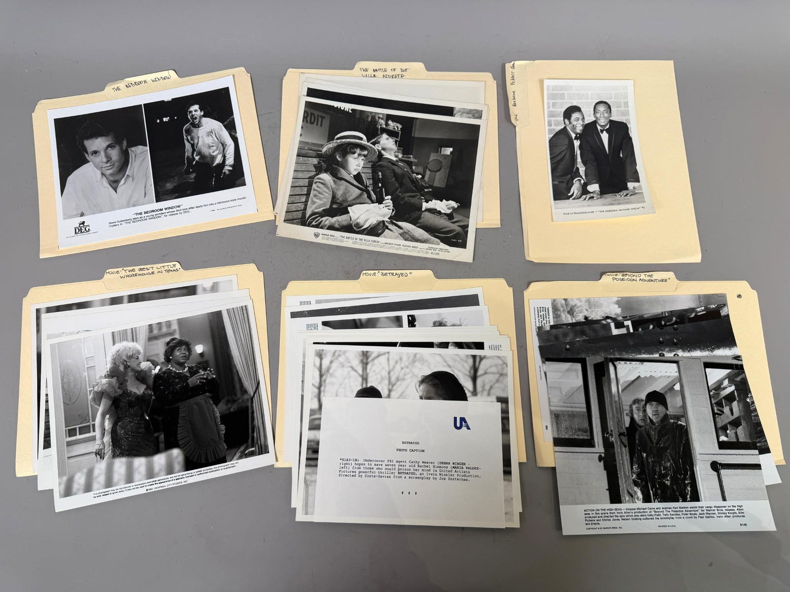 A Collection of Vintage Film and Television Publicity Stills, Mid-1960s to Late 1980s: A collection of approximately two dozen vintage black and white photographic publicity stills or press photos, dating from the mid-1960s to the late 1980s. Each print is typically a silver gelatin pri