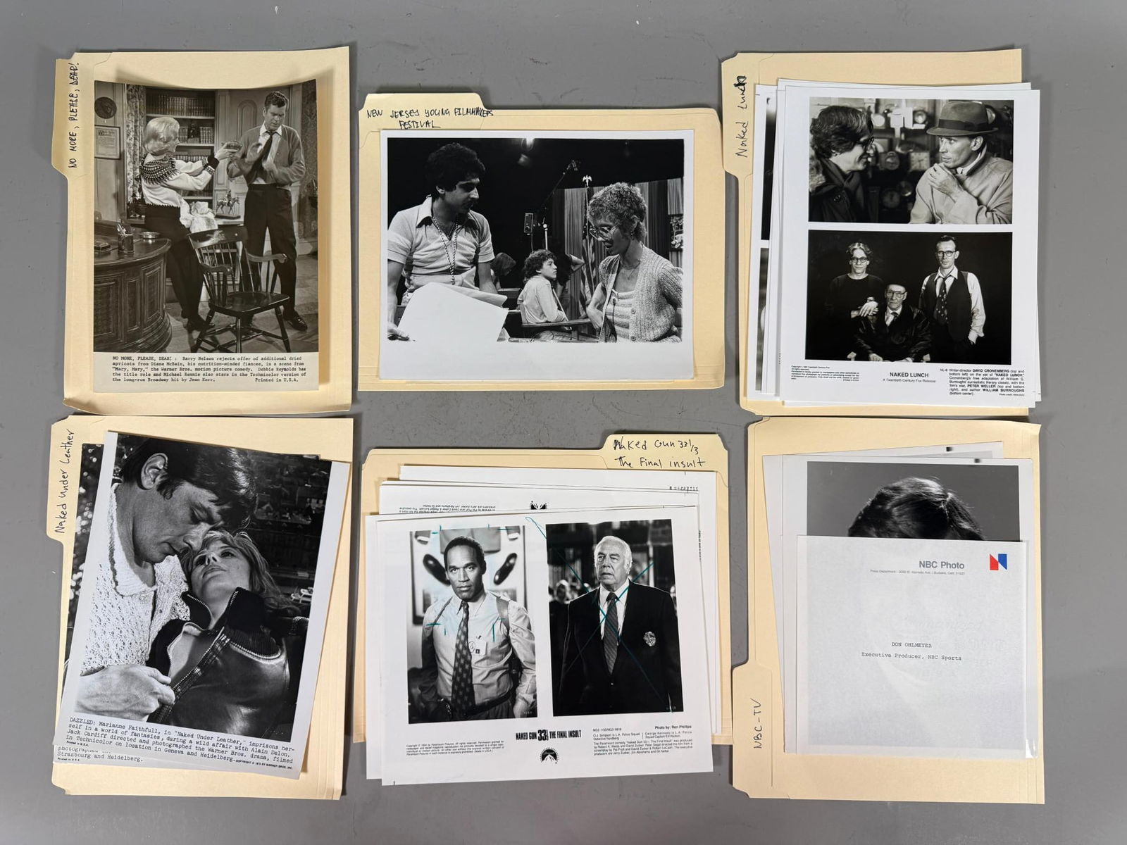A Collection of Vintage Movie and Television Press Photos and Stills: This collection comprises numerous vintage black and white photographic prints, primarily press stills and promotional photographs for various films and television productions, housed within several m