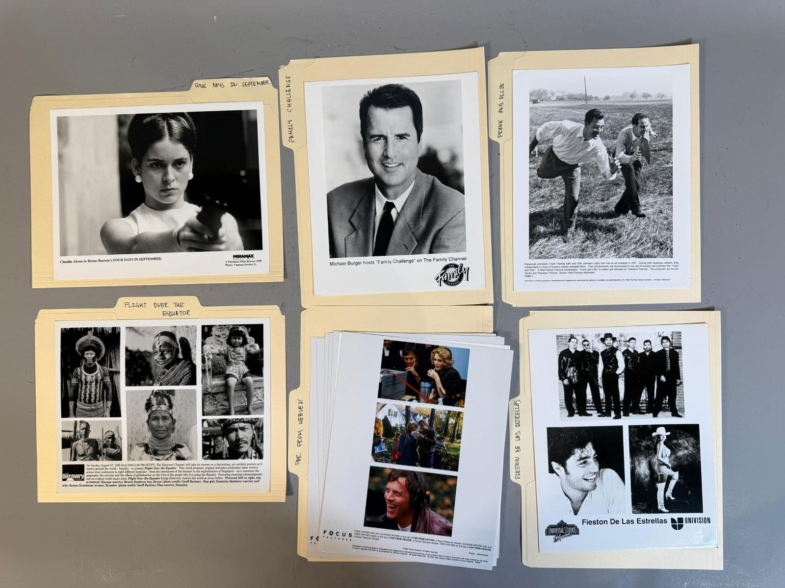 A Collection of Late 20th to Early 21st Century Promotional Photographs for Film, Television, and: This collection comprises multiple yellow manila file folders housing a variety of black and white and color photographic prints. Dating predominantly from the late 20th to early 21st century (c. 1990